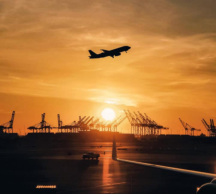 Air freight with seaport in the background